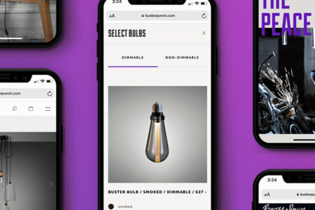 A set of smartphones displaying the Buster + Punch e-commerce website, showcasing product pages and branding against a bold purple background.