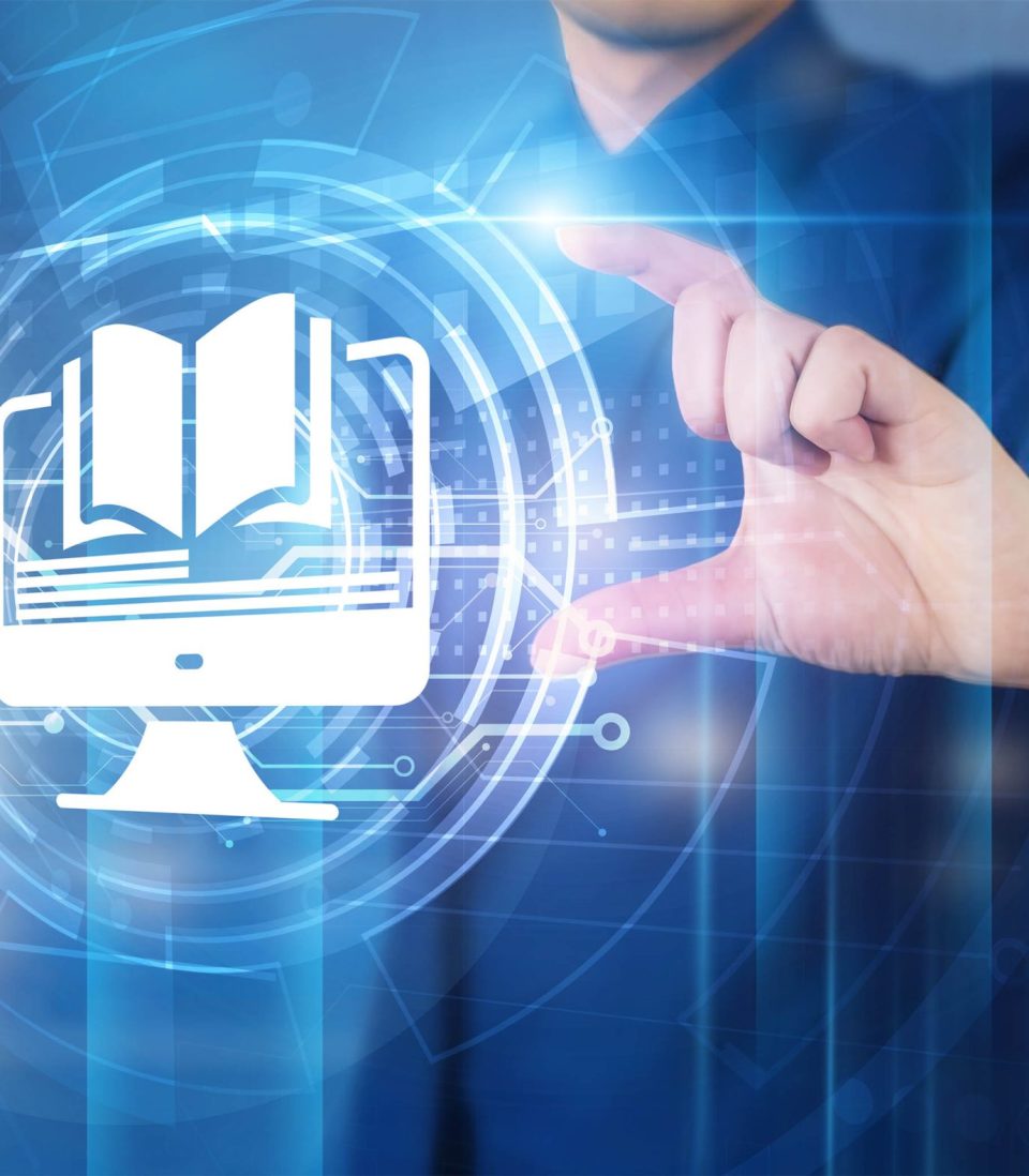 Hand pinching a glowing virtual interface featuring a computer monitor with an open book icon, representing digital content