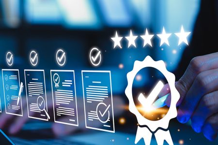 Digital quality assurance and compliance checklist with certification icon on a laptop screen.