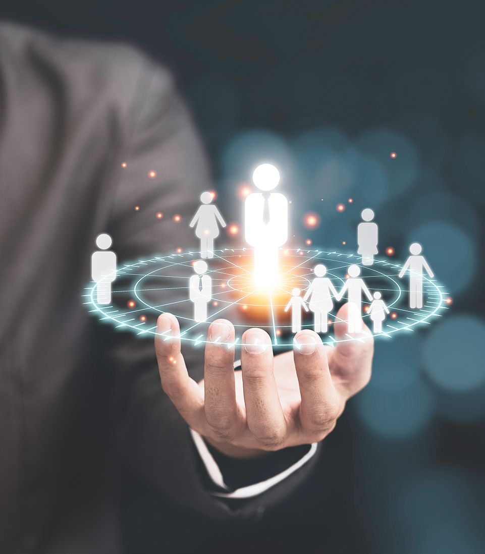 A businessperson holding a digital hologram of people icons, symbolising audience understanding and customer connection in marketing.