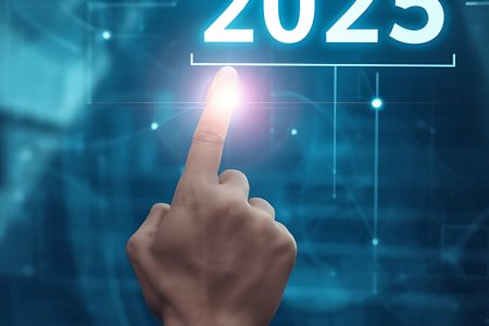 Business professional selecting “2025” on a digital interface